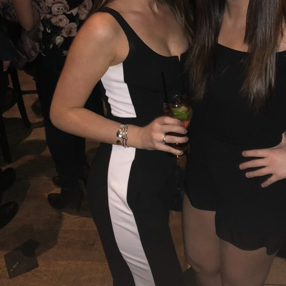 Black jumpsuit with white stripe